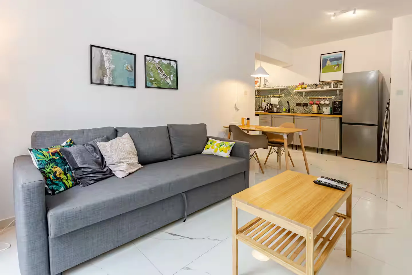 Open-plan living room, dining table and kitchen