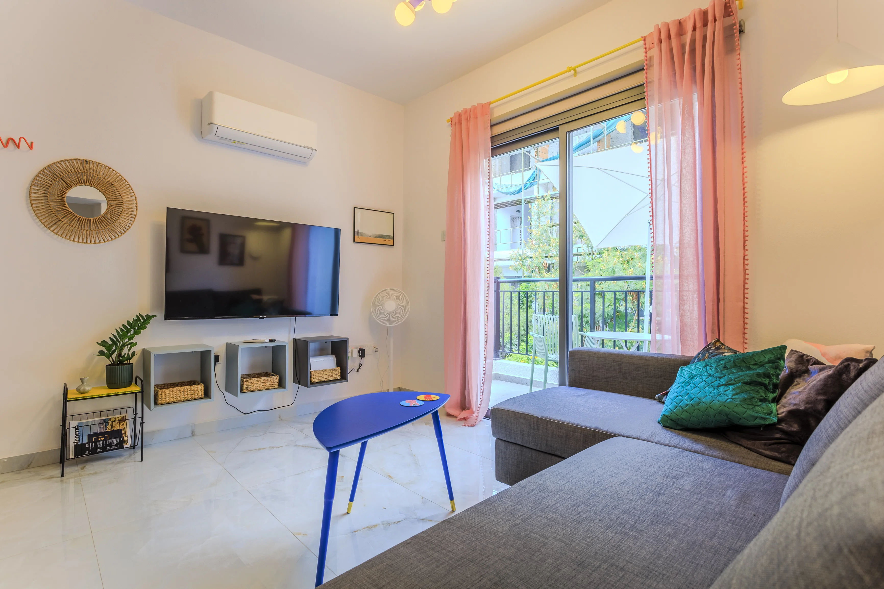 Living room with sofa bed and balcony doors